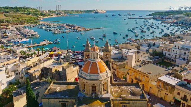 Fishing village Marsaxlokk and church. Drone view, Maltese island