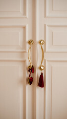 Christmas decorations on door handles close up. Winter holiday season.