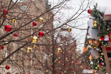 Christmas fair, traditional stalls in a city square, magical illumination at night.