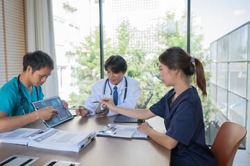 Diverse medical team in conference discussing diagnosis and strategy, physicians and nurses collaborating, consulting patients, sharing expertise, examining notes, presenting research, professional 