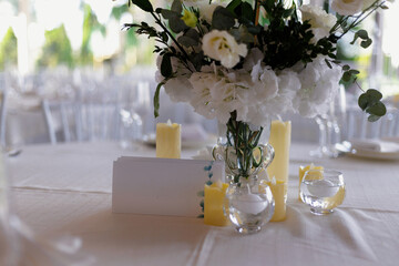 Intimate setting featuring white blossoms and soft candlelight