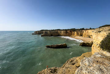Morena beach, Algarve, Portugal, rock formation cliff in southern Portugal at sunrise