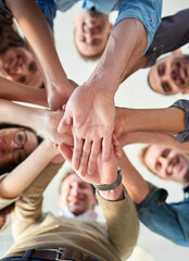 Hands, stacked and business people from low angle in office, teamwork and collaboration with support for celebration on success of startup. Excited, staff and goal with trust of networking agreement