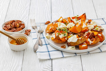 baked butternut squash with cheese, thyme, pecan