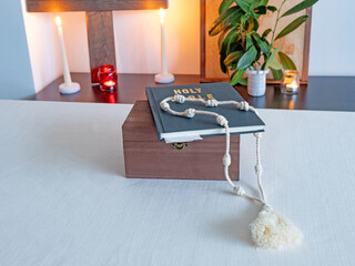 holy bible, candles and rosary in monastery