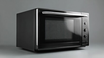A modern black countertop toaster oven sits on a gray surface.