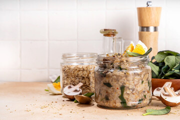 Tasty savory overnight oatmeal with spinach, mushrooms and eggs