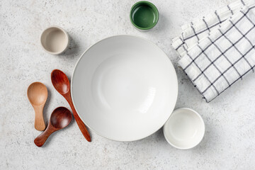 Group of empty plates, spoons and bowls. Food styling props
