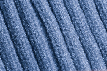 Macro Texture of Deep Blue Ribbed Knit or Corduroy Fabric