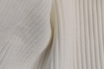 Obraz premium Macro Texture of Ribbed Knit Fabric. Cloud Dancer 11-4201.