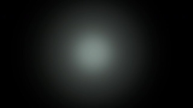 Central soft cyan glow with gradient fade on black background animation
