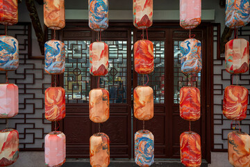 Lanterns with various patterns in front of the window