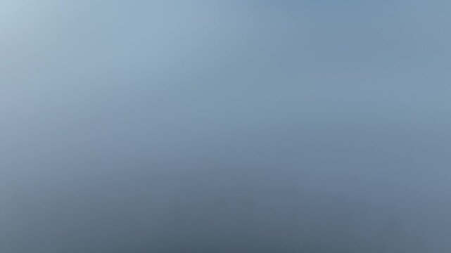 Aerial view of the sky with shades of blue and gray blending in a gradient fashion, Orschwiller, Grand Est, France.