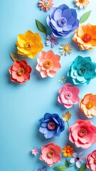Colorful paper flowers, vibrant hues, arranged on blue background. Delicate petals