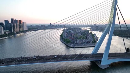 Drone flight over Rotterdam, Netherlands. New skyscrapers, city canyon, navigable canals and drawbridges in the light of sun or sunrise, drone shot. 4K