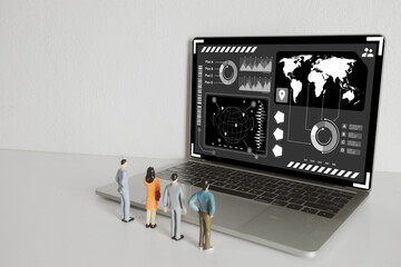Laptop screen showing digital world map and data analysis charts with miniature people, representing global market research, business strategy, financial statistics, and economic growth.