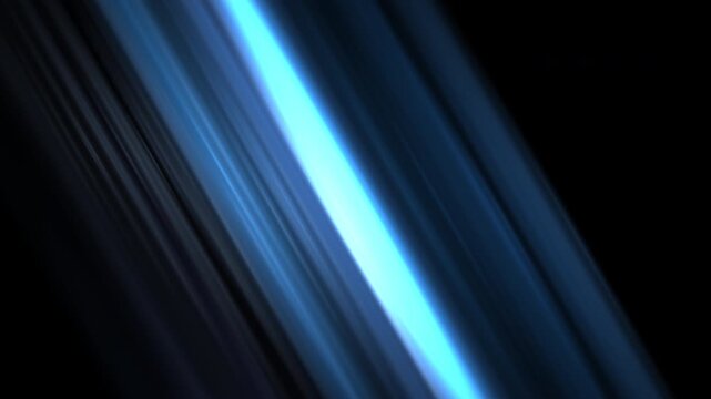 Diagonal blue light streaks on black background with abstract motion blur
