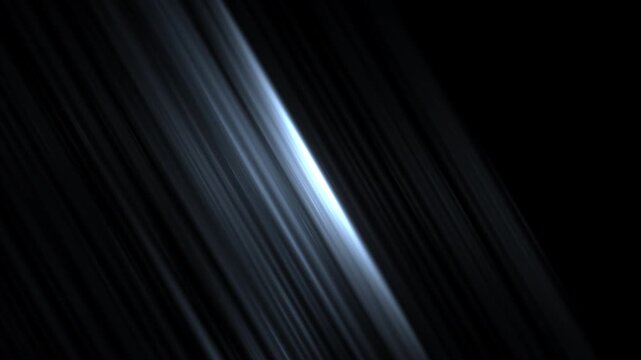 Abstract white light streaks on black background with motion blur effect
