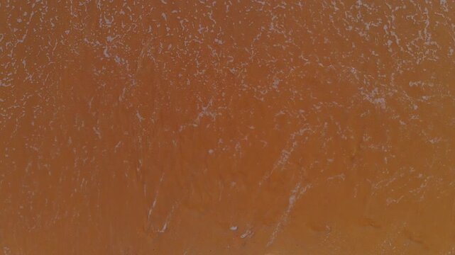 End of 2025 as Sea Waves Erase Year Written in Beach Sand