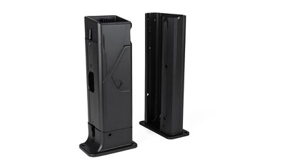 Black, vertical, oblong objects, one with visible detail, seemingly mechanical, on a white backdrop, casting slight shadows