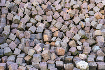 Background of square paving stones, white and reddish colors.