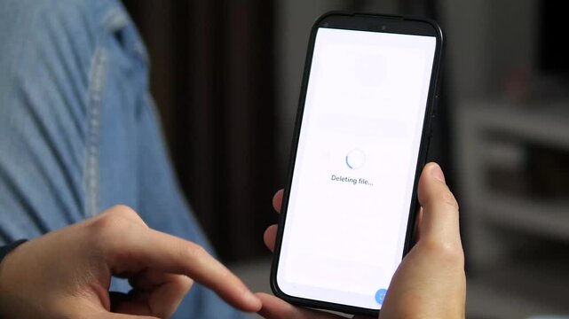 The emotional weight of a digital choice. This video shows a moment of hesitation followed by a decisive tap to delete a photo, ending with a confirmation message. It captures the mix of reluctance