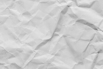 Fototapeta premium Close-up macro view of a wrinkled white paper surface,Macro white crumpled paper background,White crumpled paper texture background.