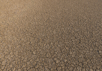 Cracked and dry soil,Close up shot of drought, dried soil photographed from top view.