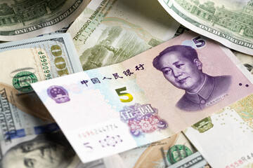 Overlapping Collage of US Dollar and Chinese Yuan Banknotes