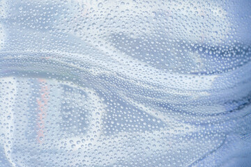 Macro droplet images on a plastic water bottle,Drops of condensate on the surface of a plastic bottle, close-up macro