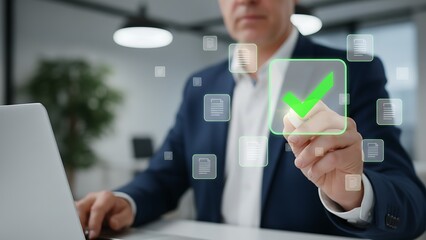 A professional man working on a laptop uses digital interface to activate a successful process, a symbol of approval. A close-up shot of hand interacting.