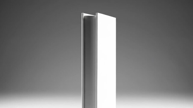 White book mockup with blank cover for design presentation on a gray background.