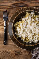 Fusilli pasta with cottage cheese, sugar and cinnamon.