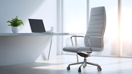 A contemporary minimalist office workspace with a grey executive chair and white desk featuring a laptop mug and plant illuminated by bright sunlight through large
