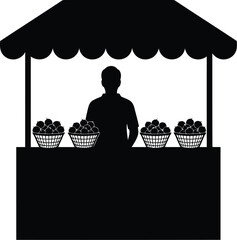 Fruit vendor standing behind market stall
