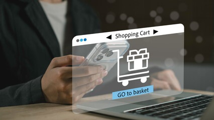 Customer using mobile phone and laptop to access shopping cart in an e-commerce platform. Concept of online purchase, checkout, and order processing system.