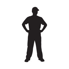 A silhouetted figure of a man standing with hands on his hips