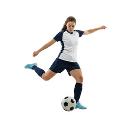 Female soccer player kicking ball isolated on white background