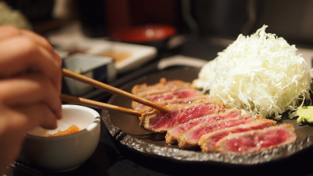 hand holding Deep-fried Beef Cutlet, Japanese-style Beef Cutle