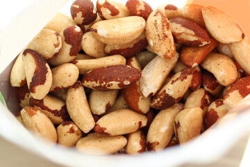 Brazil nuts in package, close-up view. Natural healthy snack rich in selenium, organic food ingredient, raw nuts texture, clean eating concept