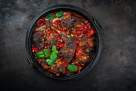  traditional authentic persian khoresh fesenjan - chicken stew with walnut and pomegranate sauce served as top view 