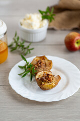 Sweet dessert of baked apples with natural honey