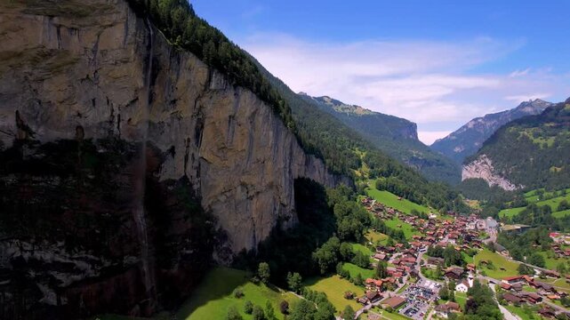 Aerial 4K Drone Reveal of Lauterbrunnen Valley with Staubbach Waterfall and Swiss Alps Village Panorama in Bernese Oberland Switzerland