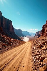 Dusty road snakes through stark, rocky desert mining terrain under deep blue expanse , remote, travel