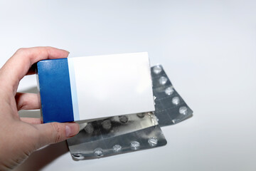 White and blue medicine package mockup with blisters.