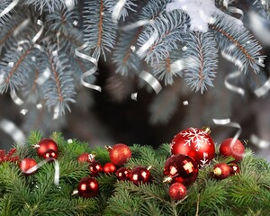 Christmas balls in setting of Winter holidays background.