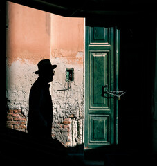 silhouette of a man with hat