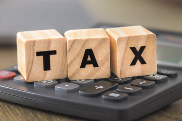 Tax word blocks on calculator for finance