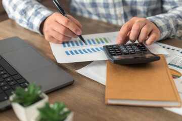 Sales analysis report with calculator and laptop