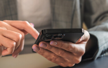 Businesswoman using smartphone for mobile banking payments